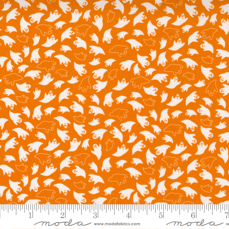 White ghosts on orange fabric