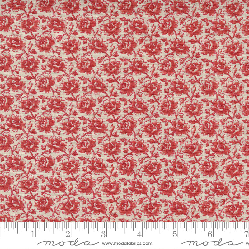 a small floral in red on dark cream