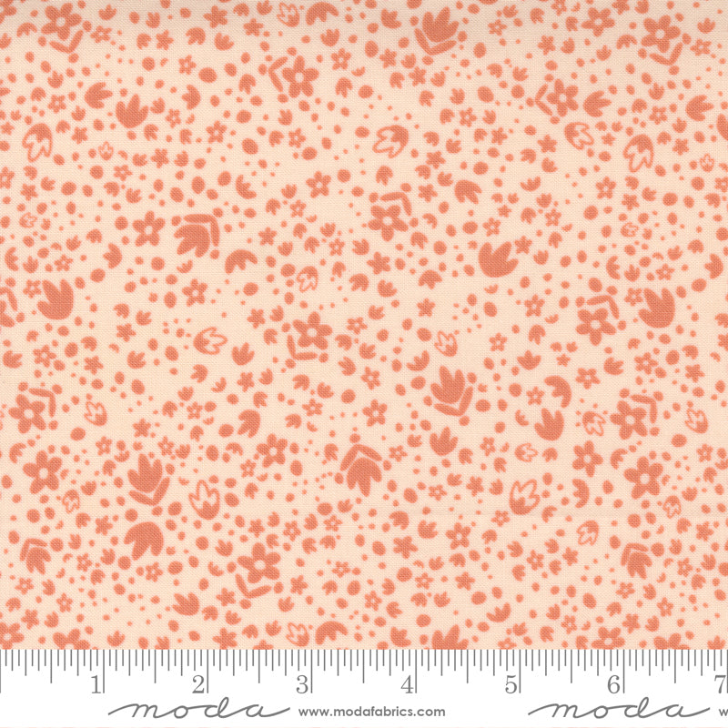A tiny floral print fabric in dark peach on a light background on ivory